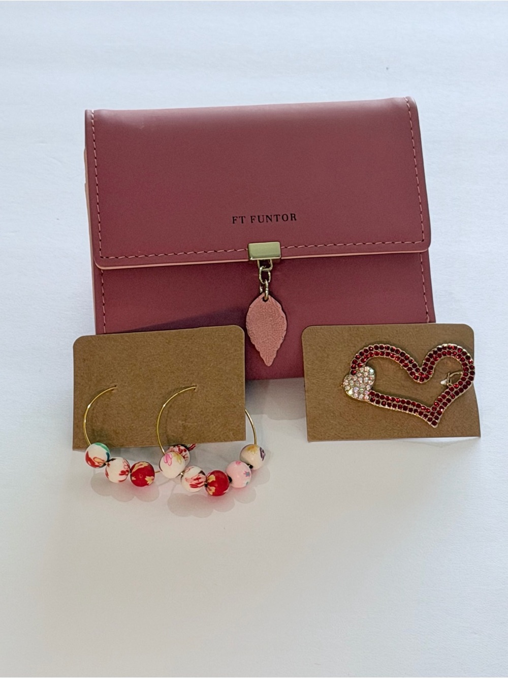 Pink Compact Wallet with Leaf Charm and accessories